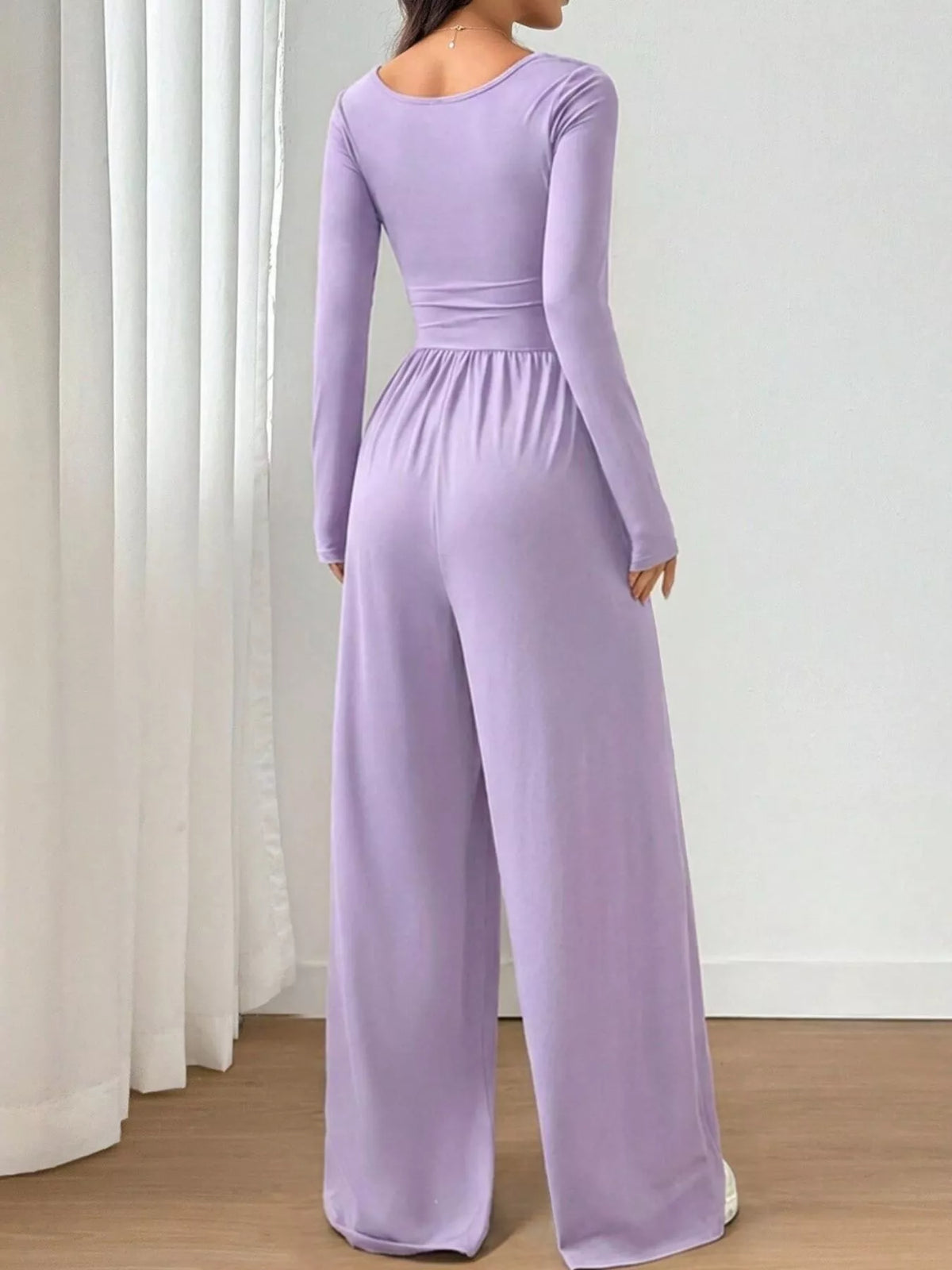 Ruched square neck wide-leg jumpsuit by Trendsi, featuring a stylish design and comfortable fit, shown in the image.