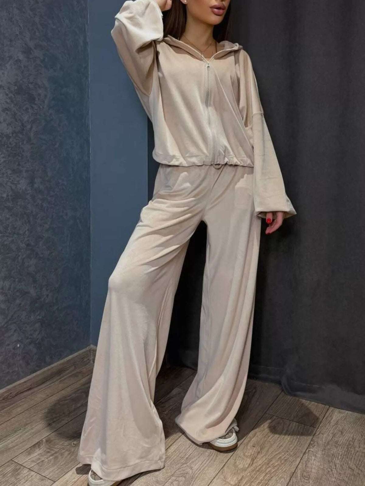 Plush Fashion Hub zip-up cropped outerwear and matching pants set, shown on a model with a casual urban background.