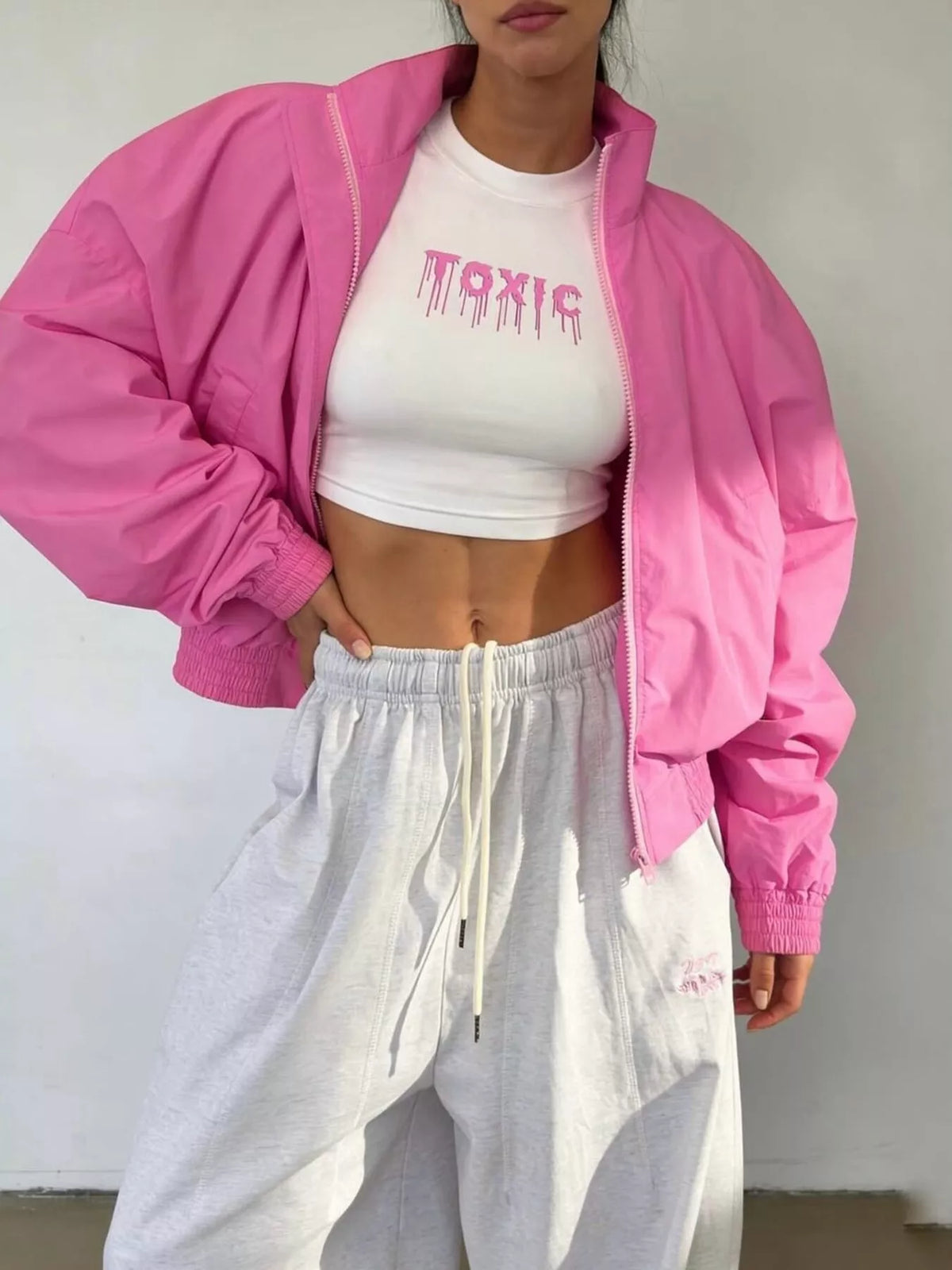 Women's oversized bomber jacket with zip-up front by Trendsi, featuring a stylish and comfortable design in the image.