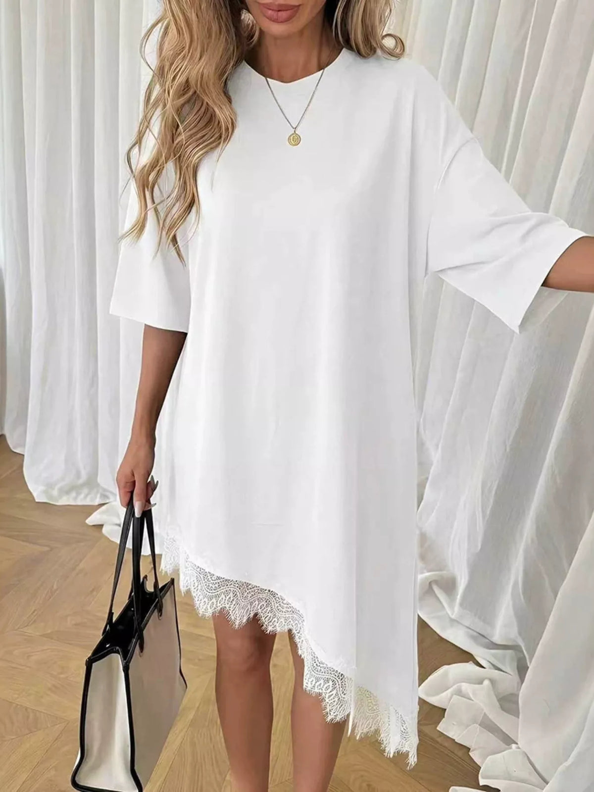 Lace trim asymmetrical hem T-shirt dress by Plush Fashion Hub, casual shirt dress with unique hem design and lace accents.