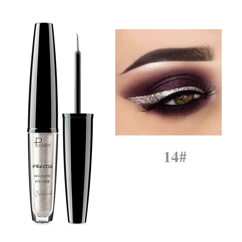 Liquid metallic silver glitter eyeliner in a clear tube with a black cap next to an eye wearing it.