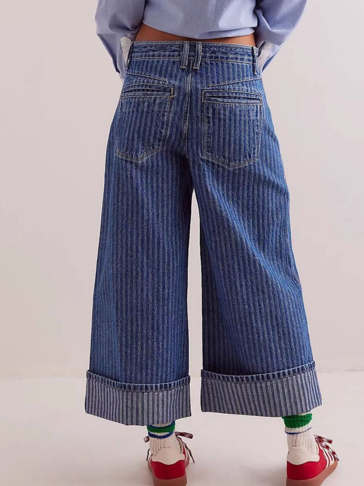 Plush Fashion Hub wide-leg cropped denim jeans with a relaxed fit and classic blue wash, displayed on a hanger against a white background.