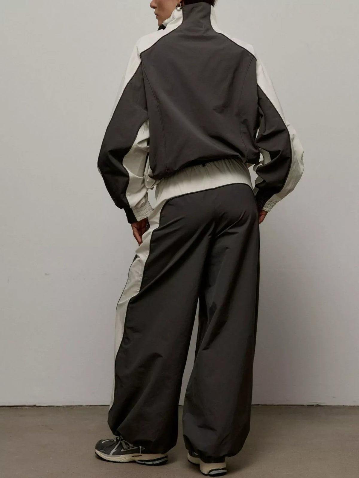 Color block zip-up outerwear and pants set by Plush Fashion Hub, featuring vibrant color blocking and casual style.