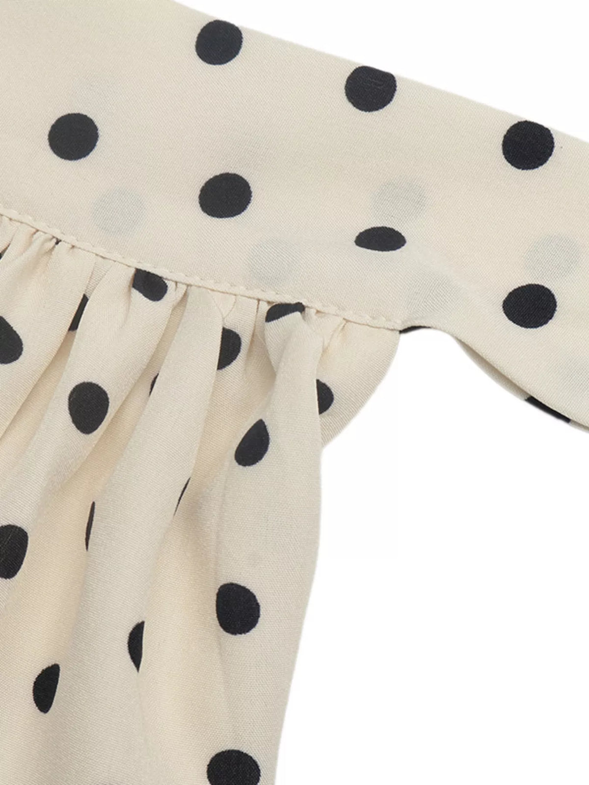 Polka dot halter neck mini dress by Plush Fashion Hub, featuring a stylish design with a fitted silhouette and playful pattern.