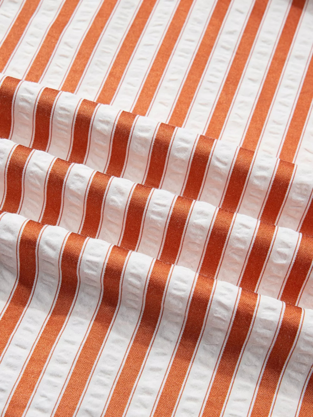 Striped V-neck mini dress by Plush Fashion Hub featuring cuffs, pockets, and a stylish mini length.