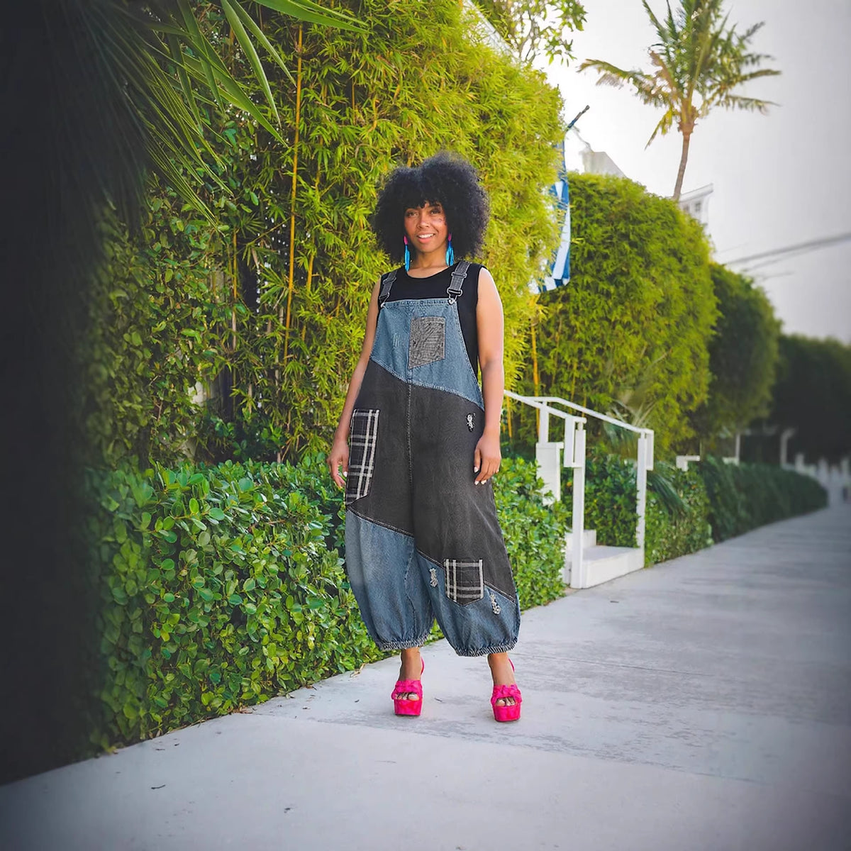 Ripped patchwork high-waisted denim overalls by Plush Fashion Hub with distressed details and adjustable straps.