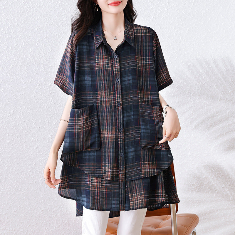 A dark blue and brown plaid button-up shirt with short sleeves, lapels, and two front pockets.