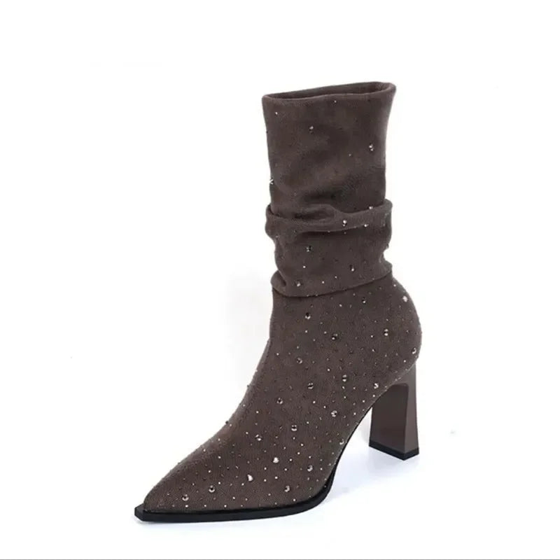 Brown suede slouch boot with rhinestone embellishments, pointed toe, and chunky block heel.