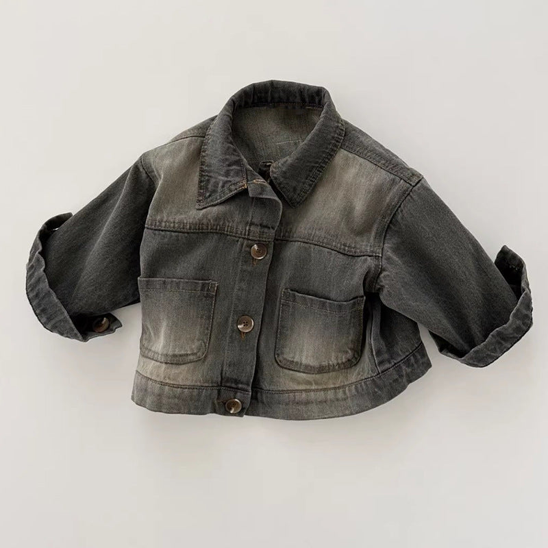 Dark grey denim jacket with a classic collar, front buttons, chest pockets, and cuffed sleeves.