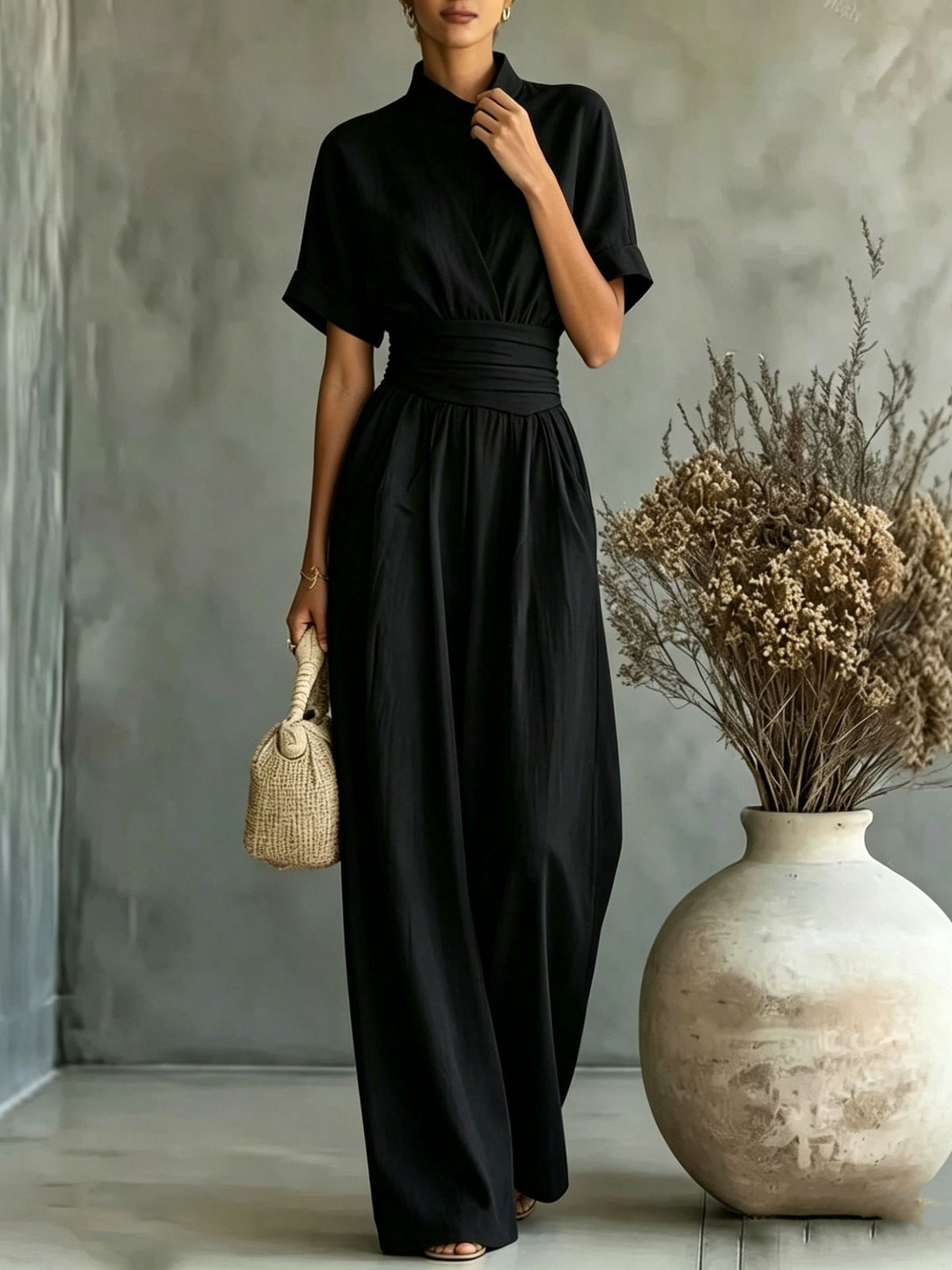 Eprolo half high neck short-sleeve wide-leg jumpsuit with a relaxed fit, shown on a model in a casual setting.