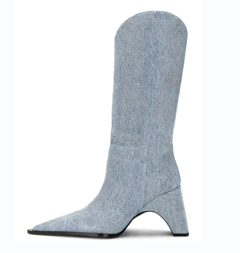 Blue denim tall boot, pointed toe, curved block heel, western style.
