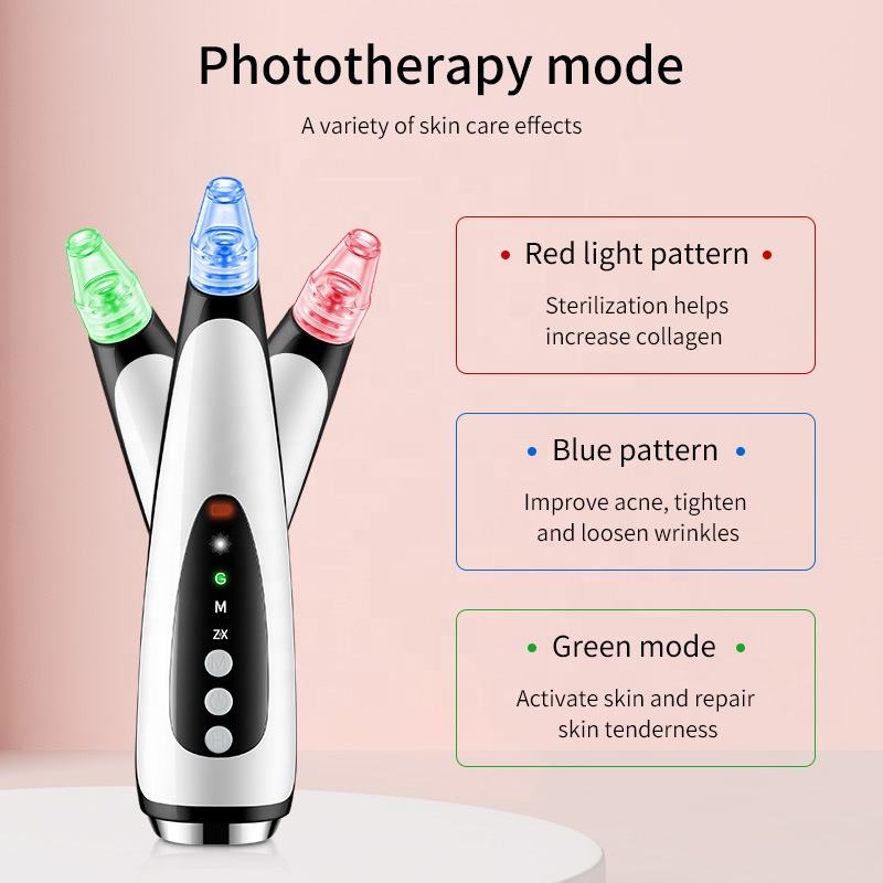 Black and white plastic skincare device with interchangeable green, blue, and red light-up tips and control buttons.