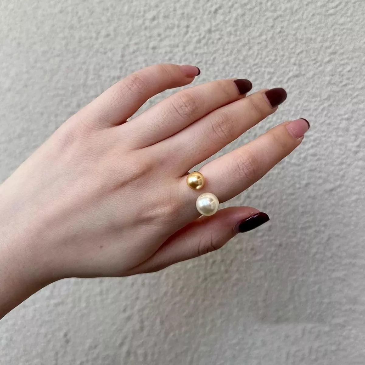 Elegant double pearl open ring by Plush Fashion Hub featuring two lustrous pearls on a sleek silver band.