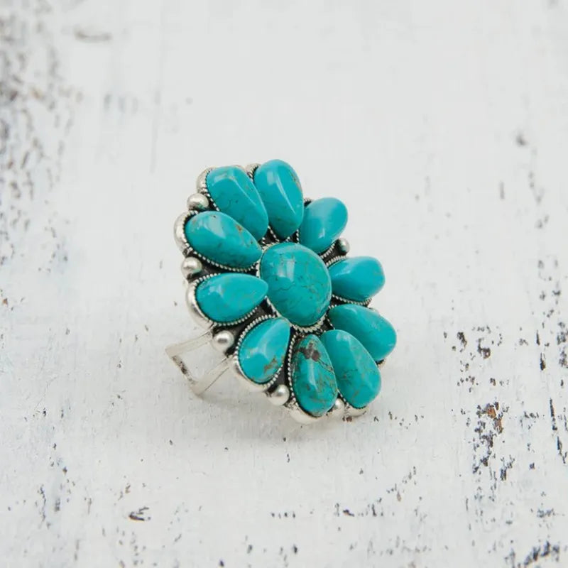 Artificial turquoise alloy flower ring featuring a detailed floral design, perfect for stylish jewelry and fashion accessories.