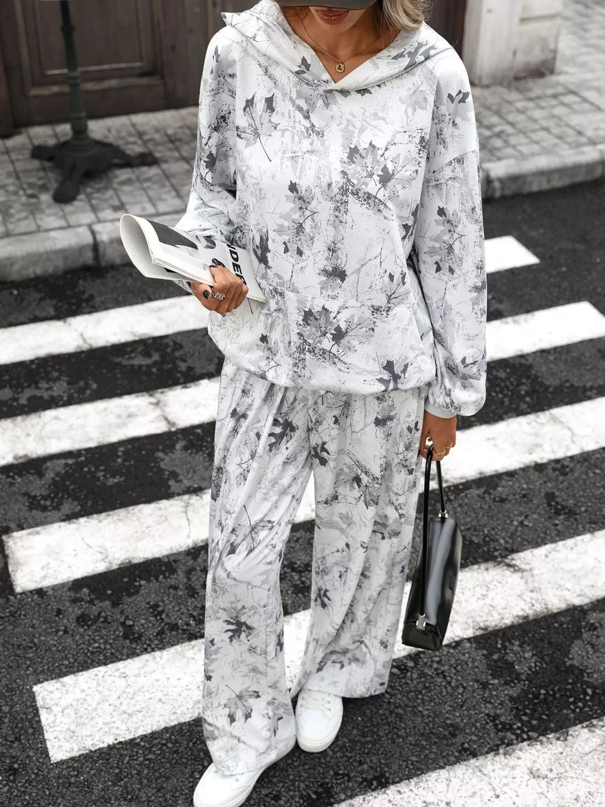 Printed long sleeve hoodie and pants set by Trendsi, featuring a stylish design, soft fabric, and comfortable fit.