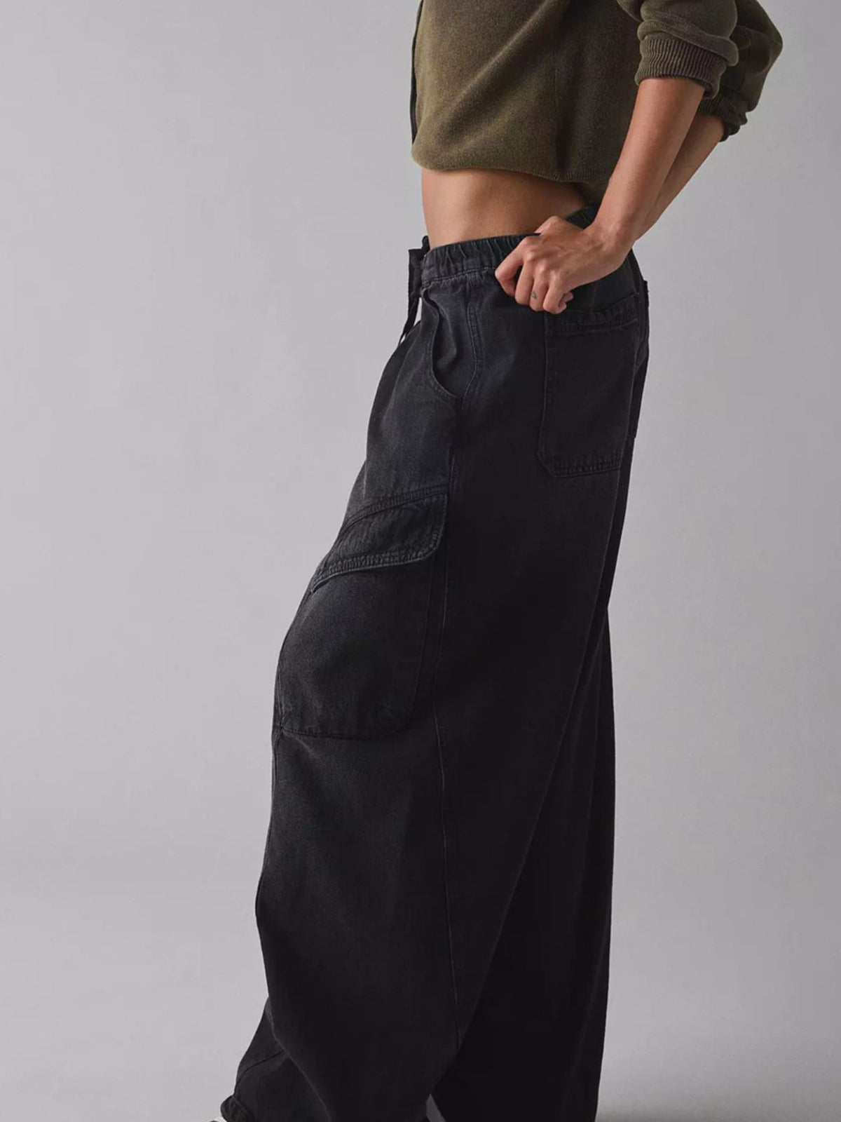 Women's relaxed fit utility denim cargo jeans by Plush Fashion Hub with drawstring waist, featuring multiple pockets and casual style.