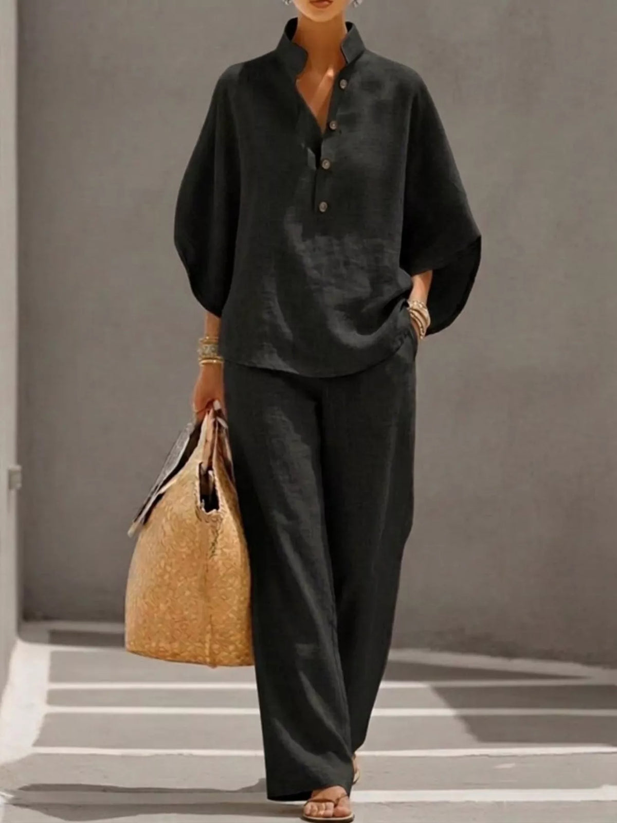 Plus size women's two-piece set with button-detail 3/4 sleeve top and matching pants, stylish dress by Plush Fashion Hub.