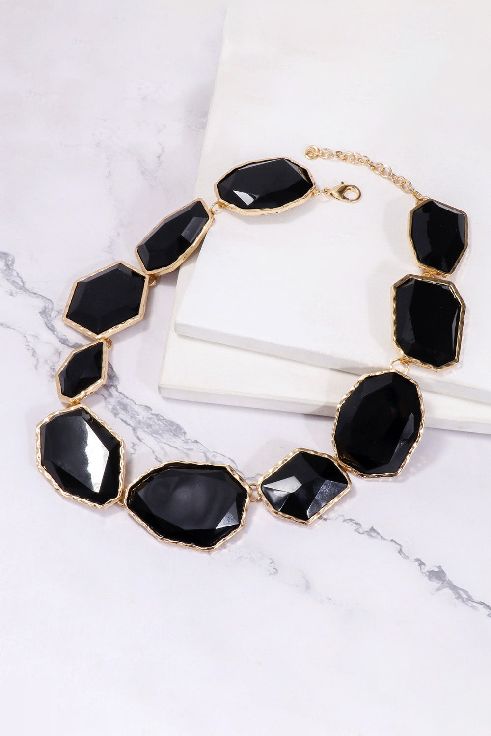 Geometrical resin necklace with zinc alloy frame, featuring colorful geometric shapes and modern jewelry design.