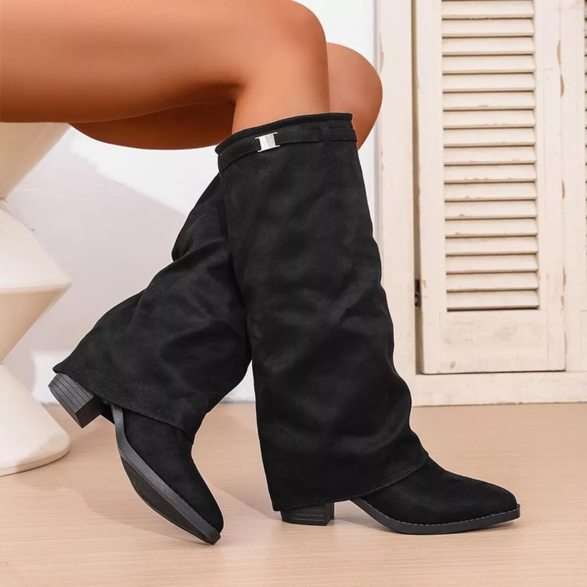 Point toe block heel boots from Trendsi, stylish footwear with a sleek silhouette and sturdy block heel for a chic look.