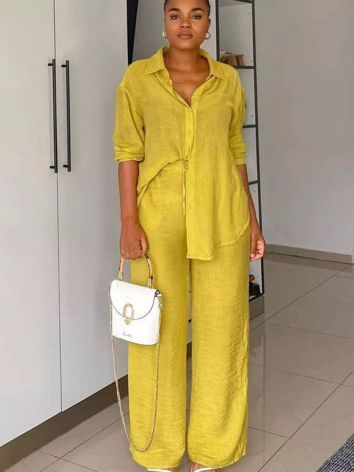 Plush Fashion Hub tie-front top and wide-leg pants two-piece set displayed on a model, showcasing stylish casual fashion.