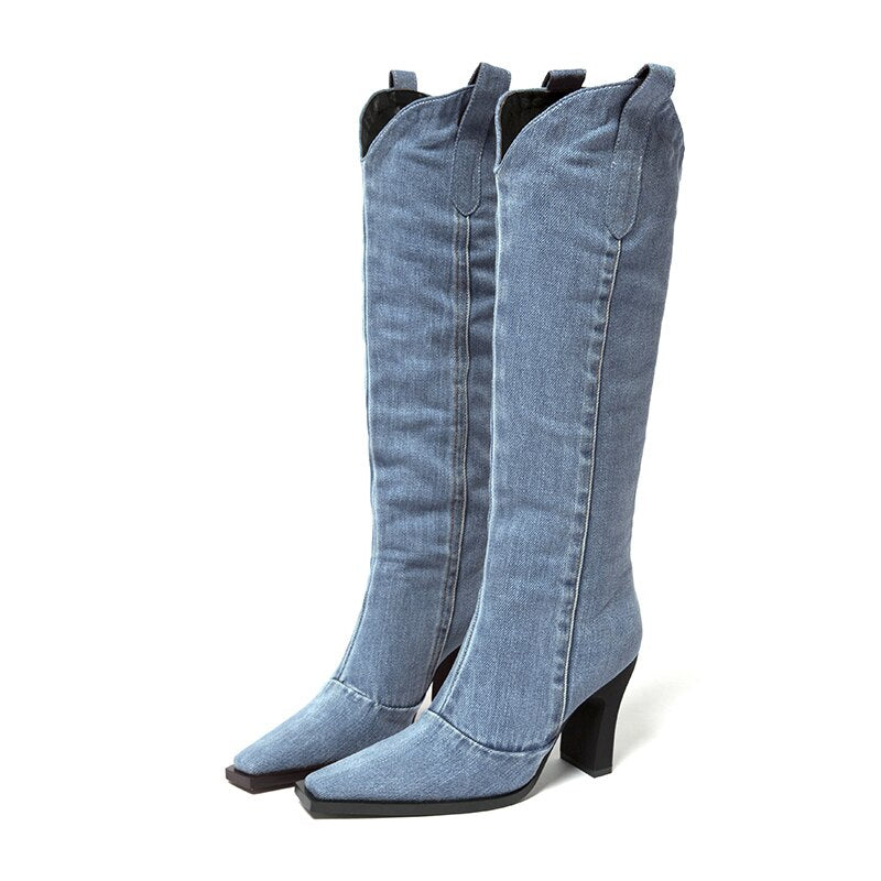 Light blue denim knee-high boots with square toes, black heels, and pull tabs.