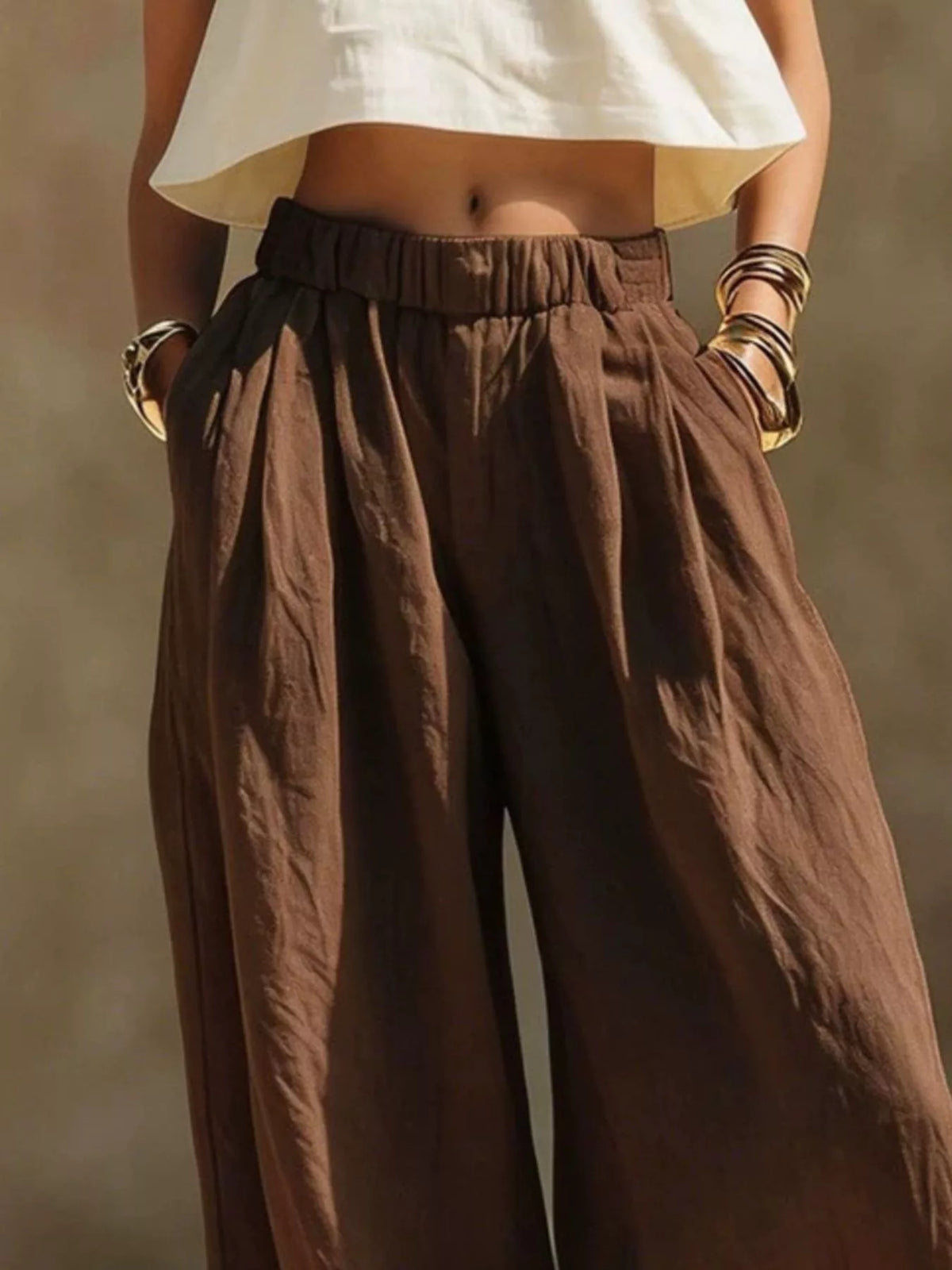 Plus size wide leg pants with full elastic waistband from Trendsi, shown in a relaxed fit style.