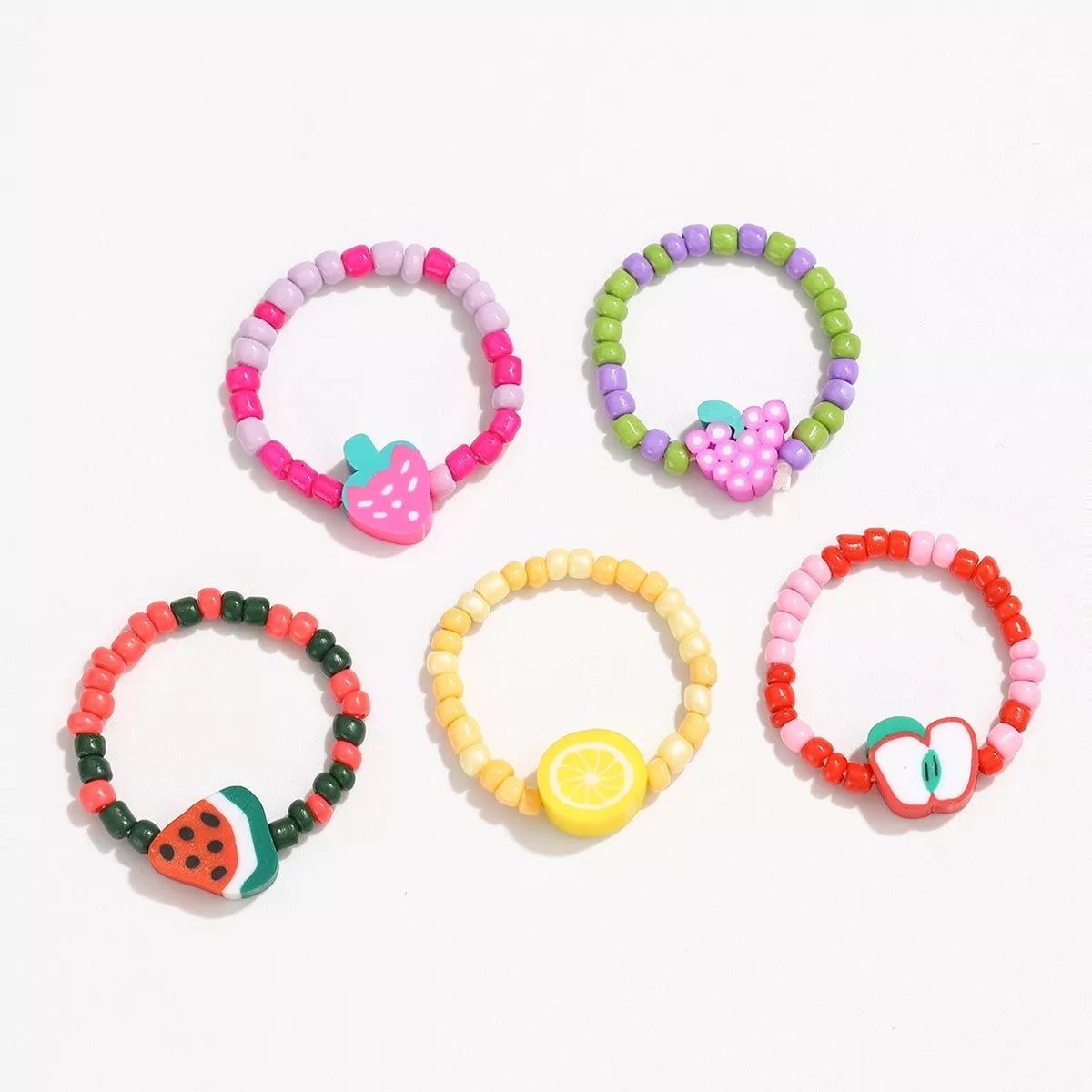 Colorful fruit charm beaded ring featuring vibrant fruit-shaped beads, perfect for a fun, casual accessory from Plush Fashion Hub.