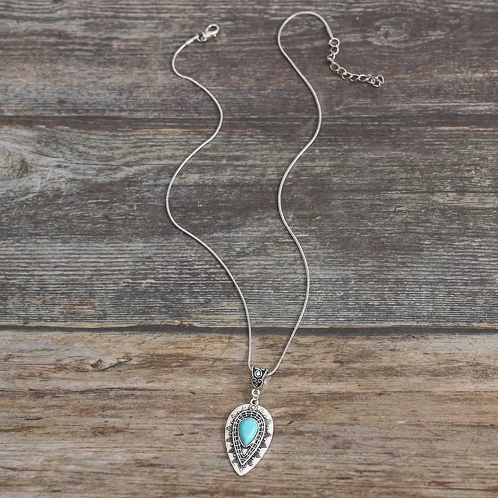 Geometric alloy pendant necklace with modern design, featuring sleek shapes and a polished finish, ideal for stylish jewelry accents.