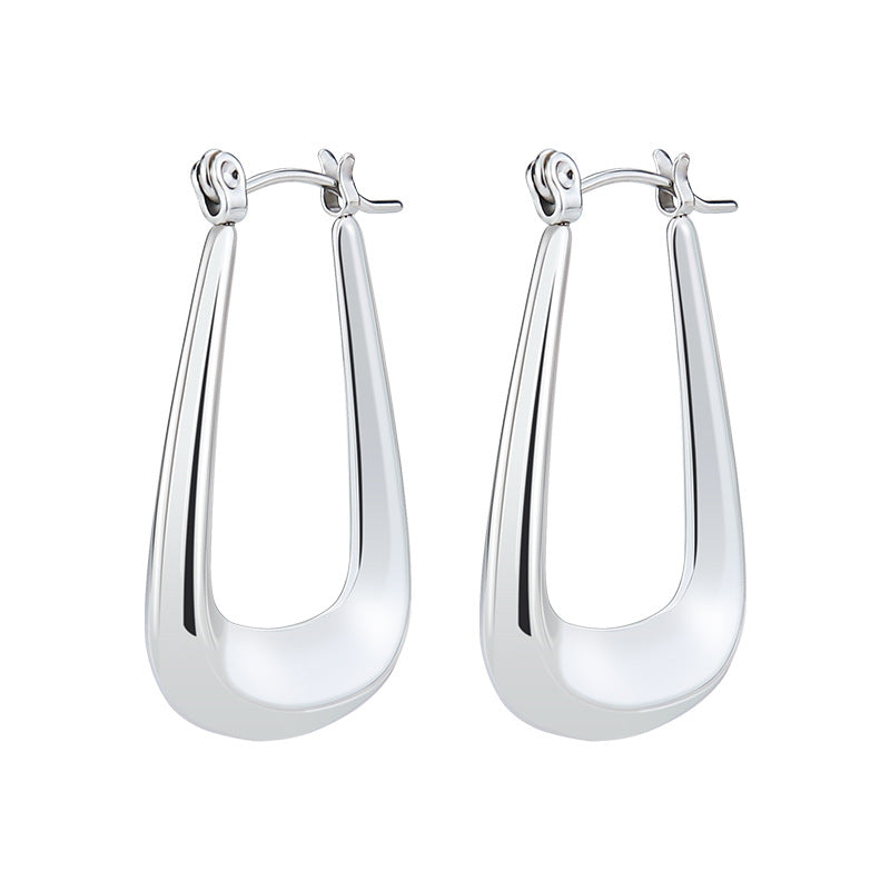Polished silver-tone metal U-shaped huggie hoop earrings with a latch-back closure.