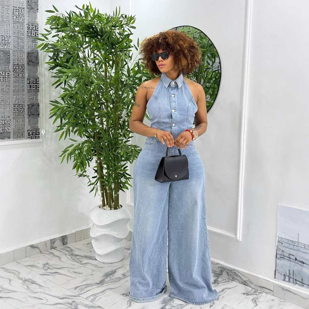 Women's backless washed denim halter jumpsuit by Plush Fashion Hub, featuring a stylish fit and casual denim fabric.
