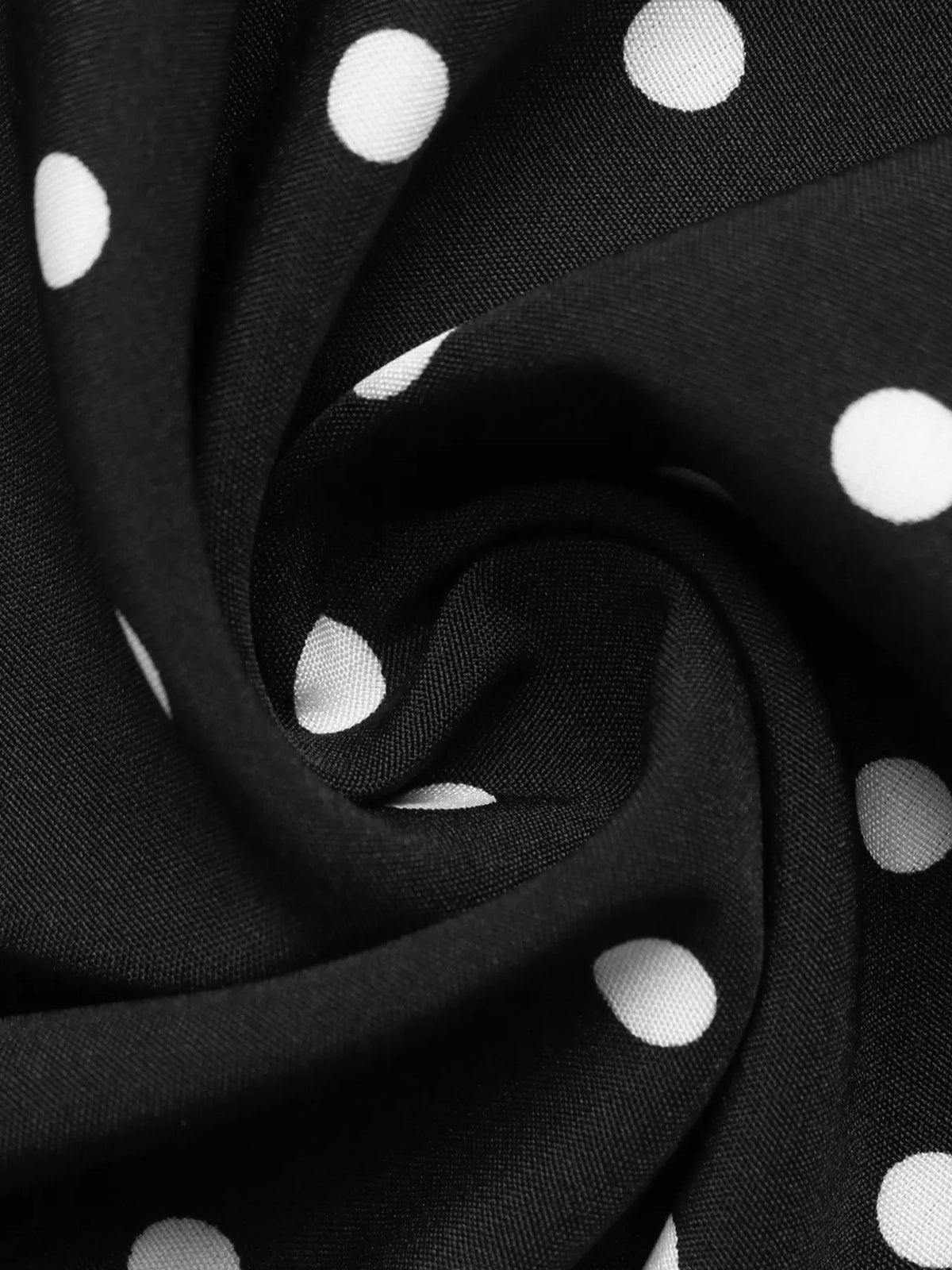 Polka dot Peter Pan collar dress by Plush Fashion Hub featuring a classic design with a round collar and vintage-inspired style.