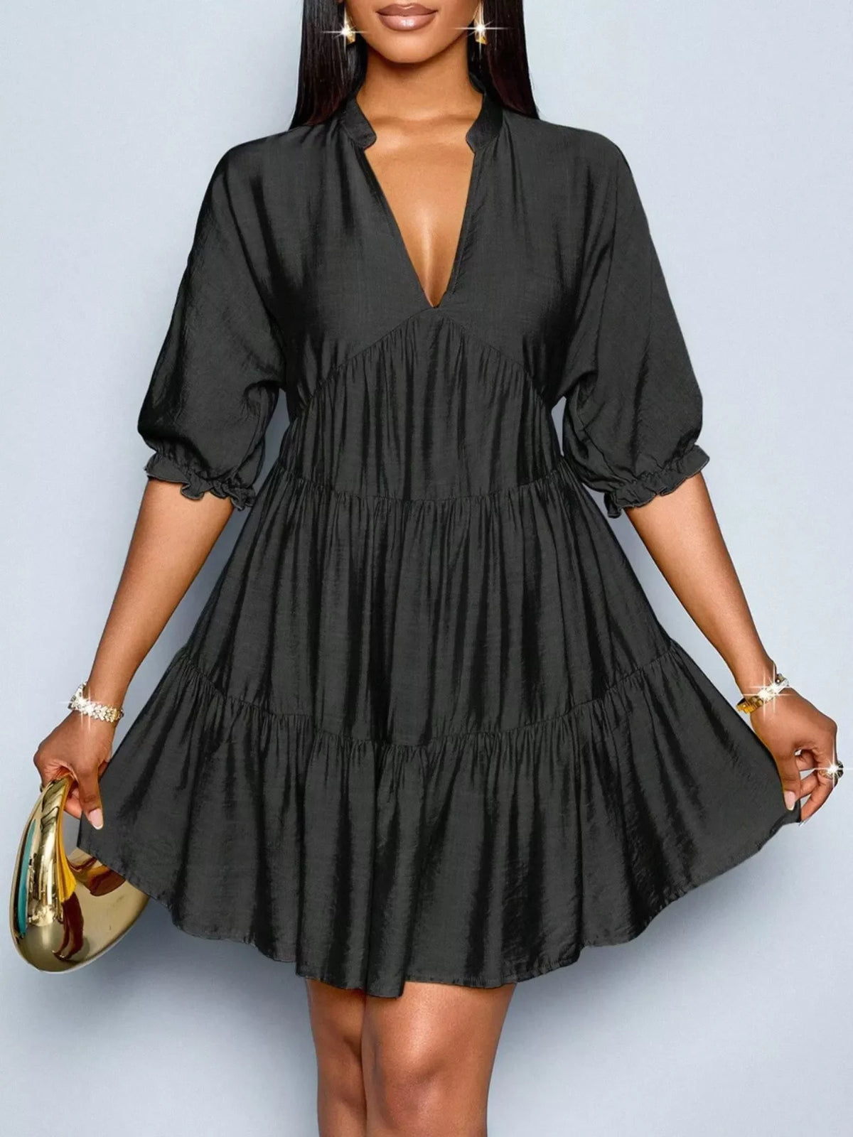 Notched half sleeve tiered dress by Plush Fashion Hub, featuring layered fabric and a stylish design.