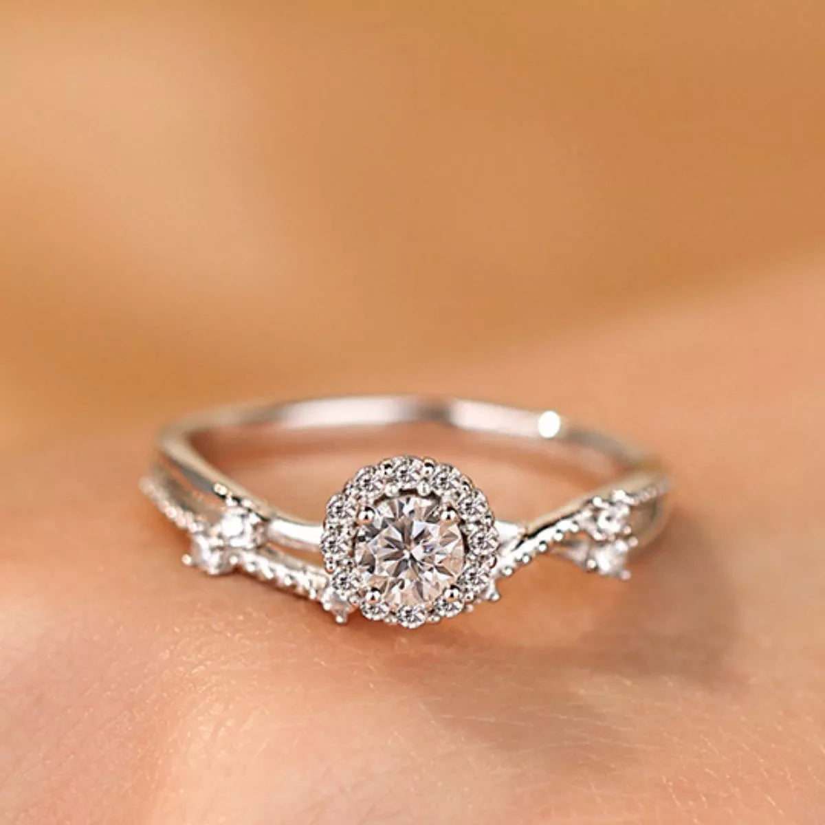 Sterling silver layered ring with 1 carat moissanite gemstone, featuring a sleek design and intricate detailing.