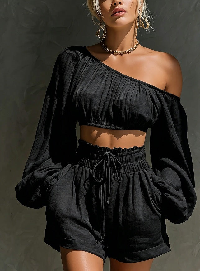Women’s long sleeve short top and high-waisted casual shorts set by Plush Fashion Hub, shown in a stylish outfit.