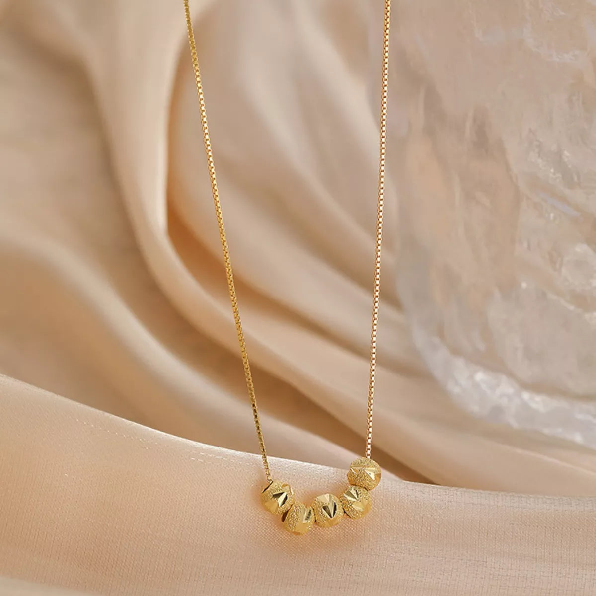 Sterling silver beaded necklace with polished round beads, stylish jewelry accessory by Plush Fashion Hub.