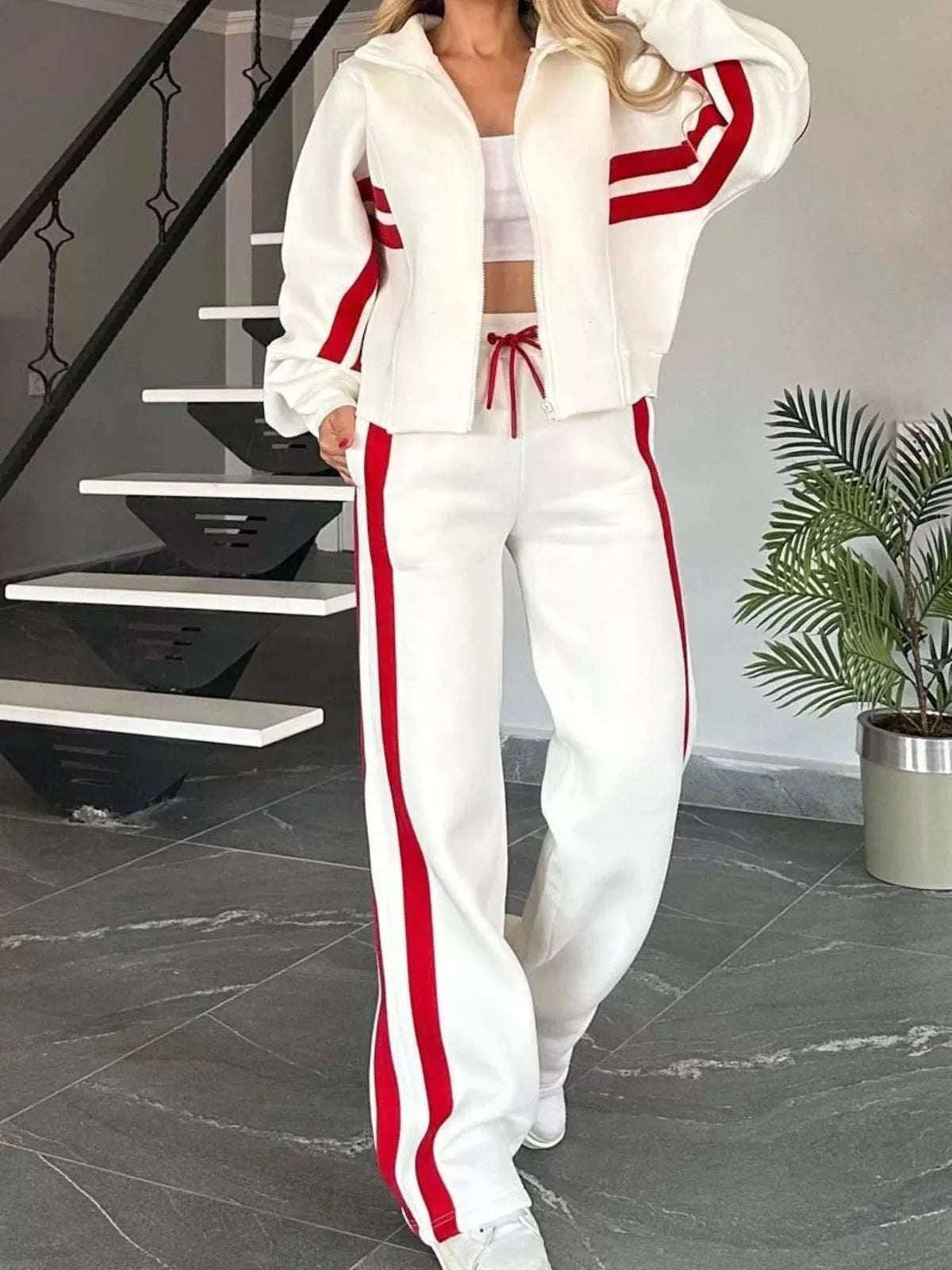 Plus size contrast stripe zip-up jacket and pants activewear set by Plush Fashion Hub, featuring sporty design and bold color accents.