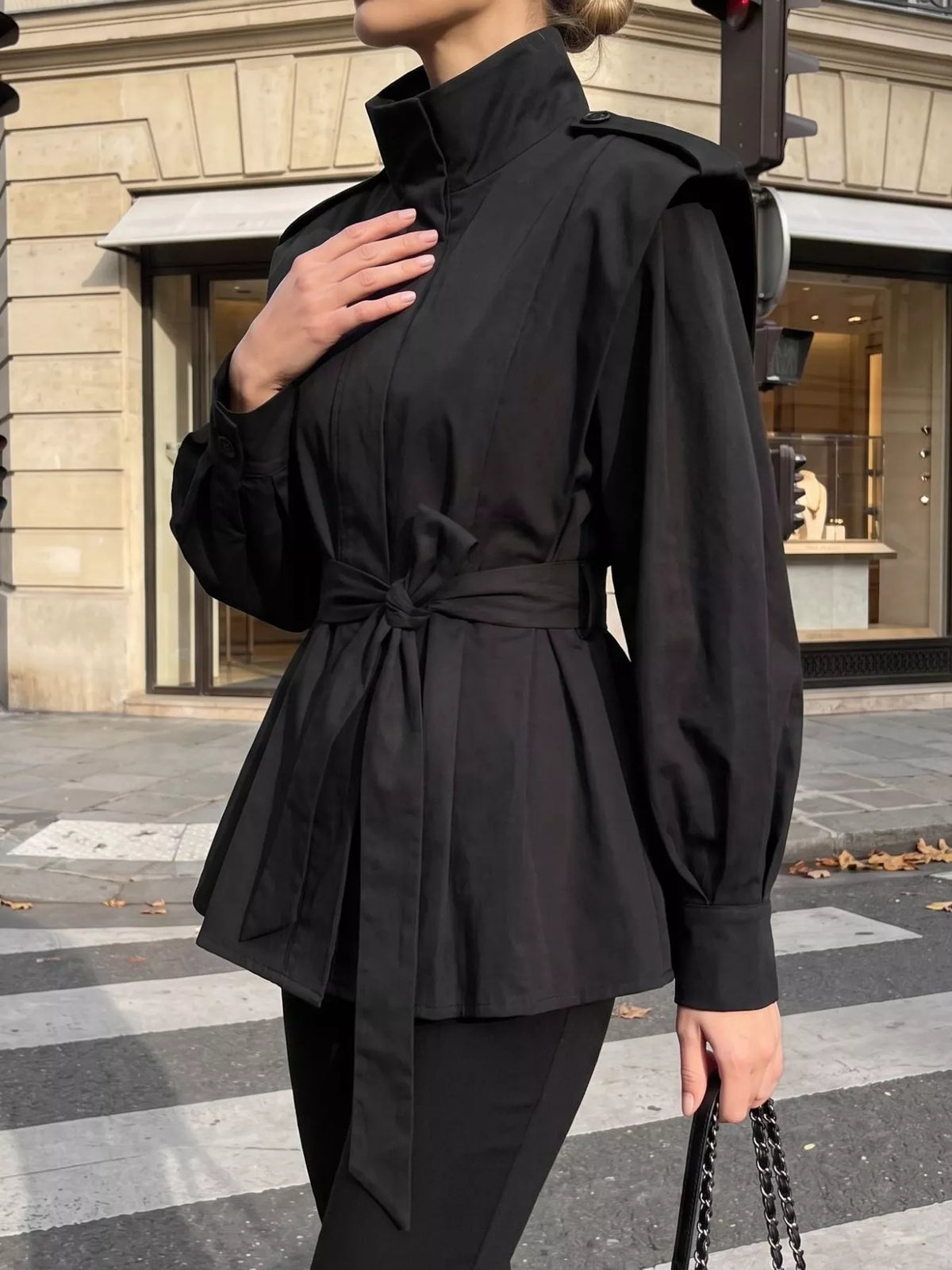 Trendsi stand-collar belted outerwear jacket with button closure and side pockets, stylish and warm for cold weather.