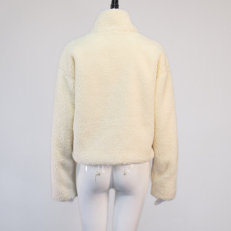 A white fluffy fleece jacket displayed on a white mannequin from the back.