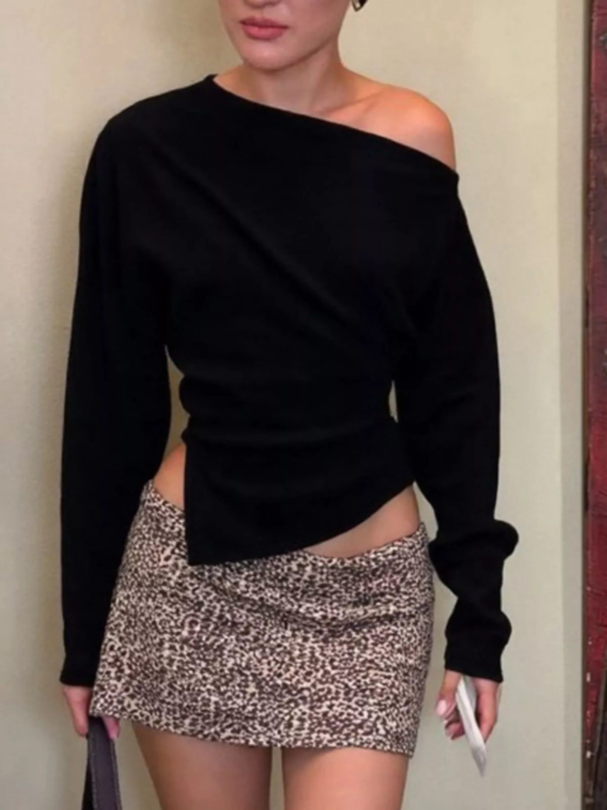 Asymmetrical off-shoulder long sleeve T-shirt by Plush Fashion Hub, featuring a stylish design and fitted silhouette.