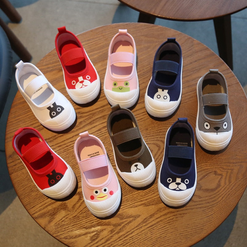 Canvas Mary Jane shoes in various colors with cute animal faces on white toes and strap closures.