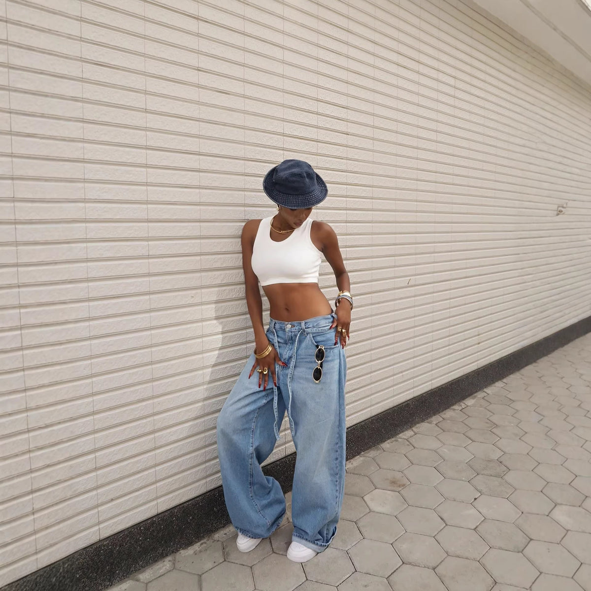 Washed denim high-waisted straight-leg jeans with tied waist from Plush Fashion Hub, displayed on a model.