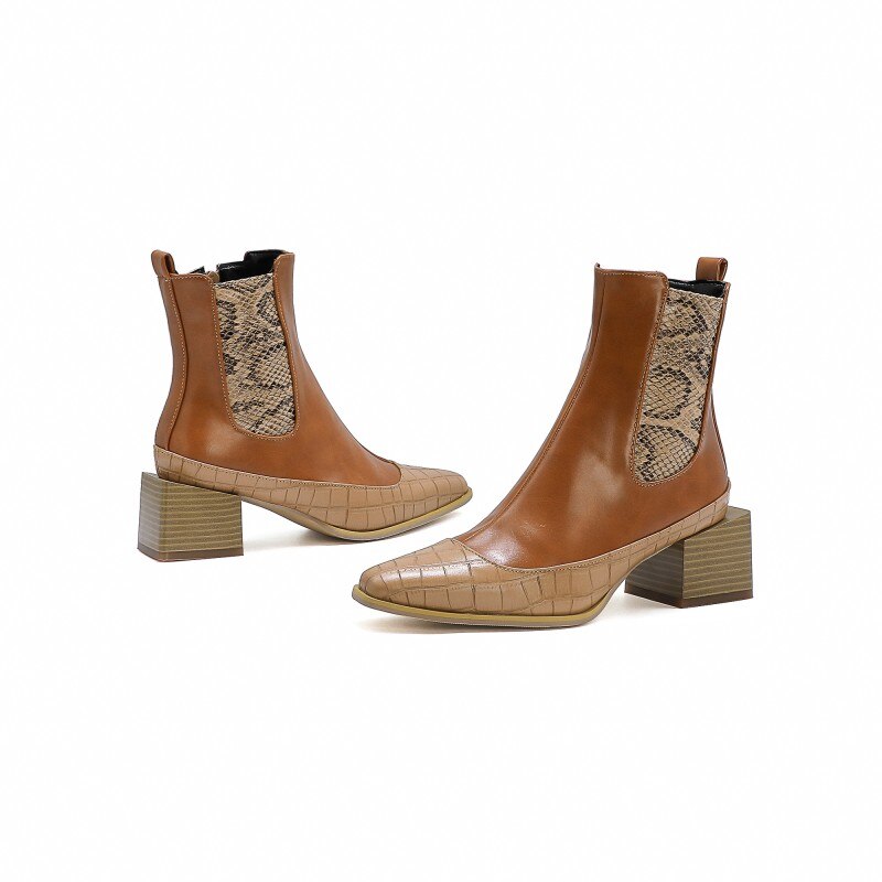 Brown leather ankle boots with faux snakeskin side panels, crocodile-embossed toes, and chunky block heels.