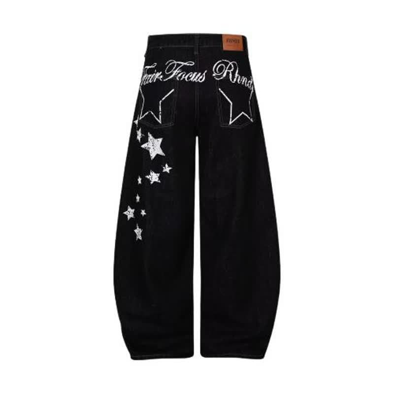 Black baggy slash-style jeans with star print from eprolo, featuring a relaxed fit and distressed design.