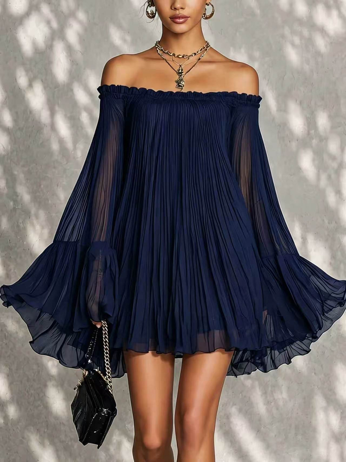 Elegant black off-shoulder backless mini dress with pleated lantern sleeves, stylish and sophisticated for special occasions.