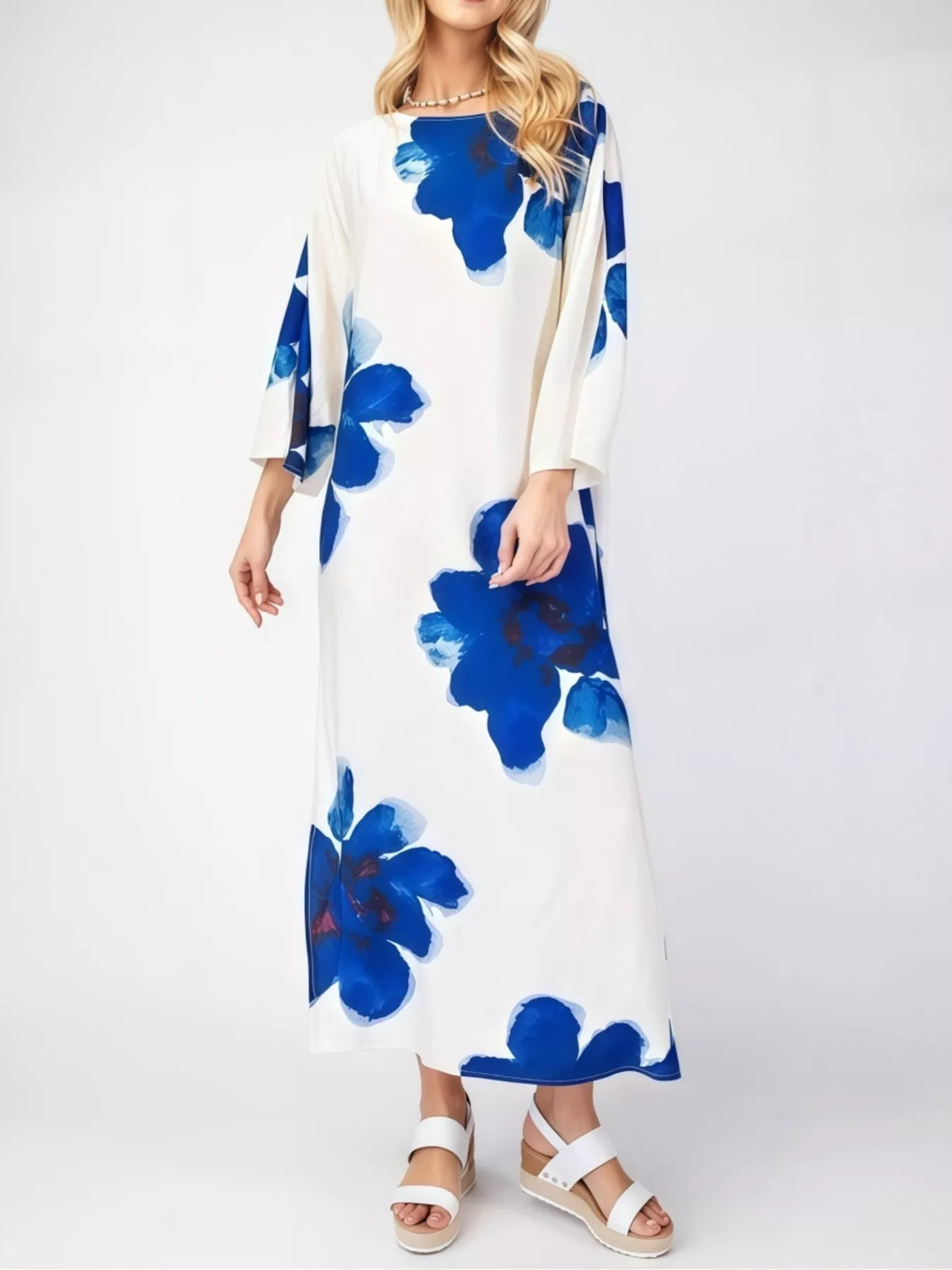 Floral print round neck dress by Plush Fashion Hub featuring a flowy design and vibrant floral patterns.