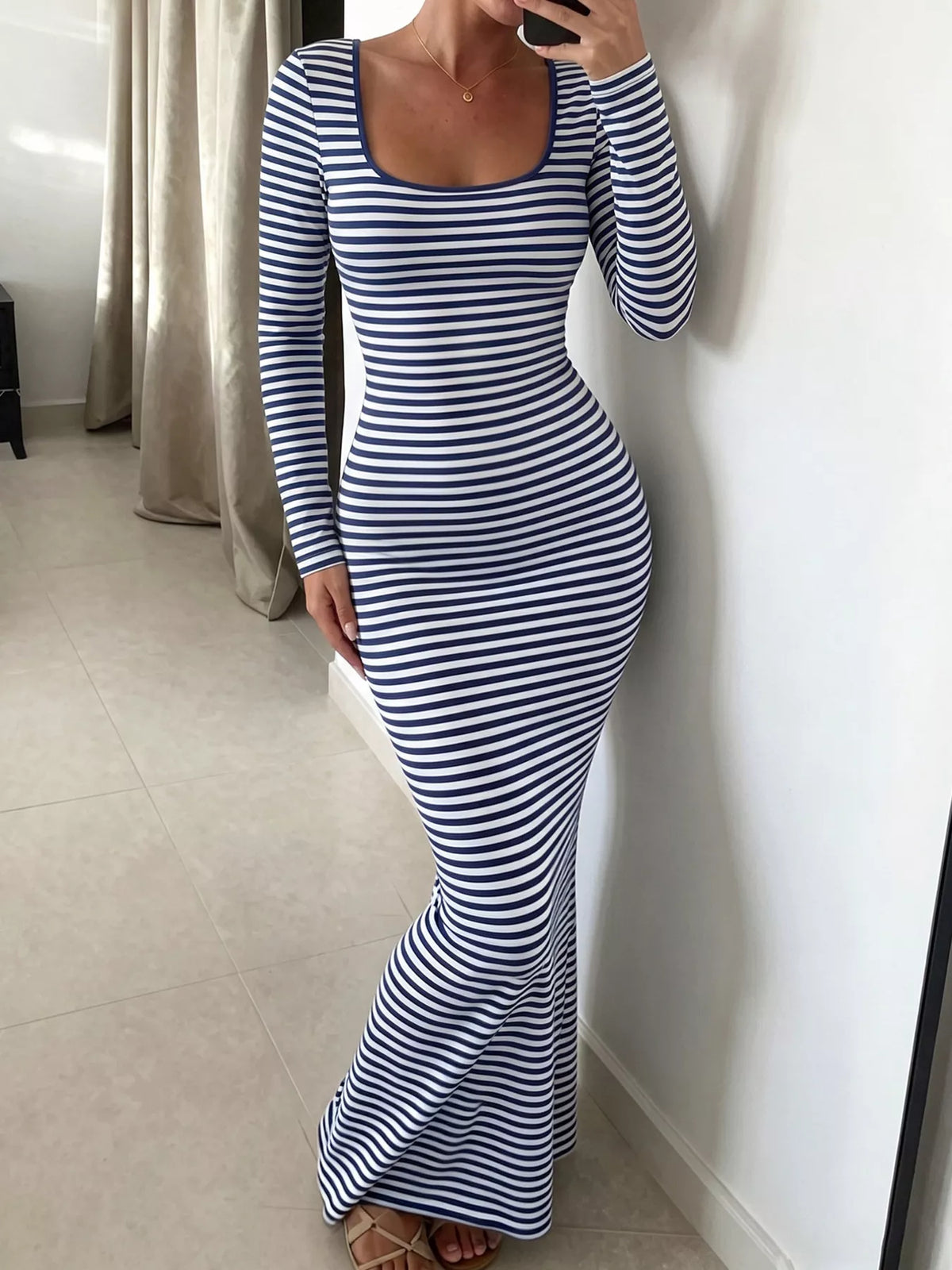 Women's striped long sleeve square neck maxi dress by Trendsi, featuring a flowing design and stylish pattern.