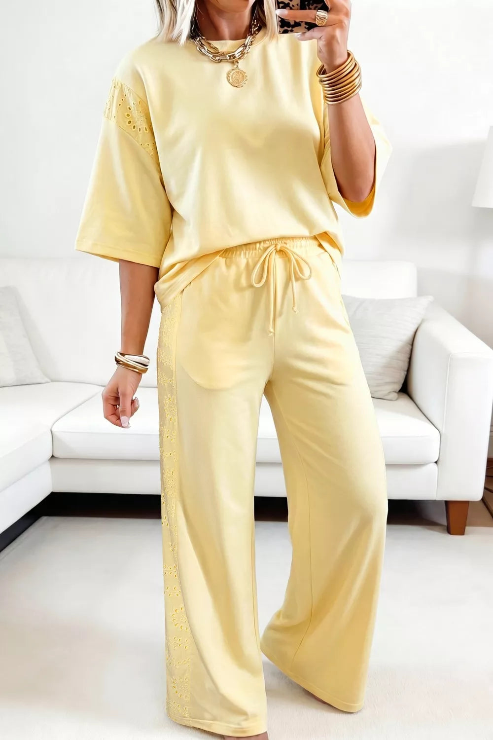 Plush Fashion Hub plush half-sleeve top and drawstring pants set, soft fabric, casual loungewear, rings detail on the fabric.