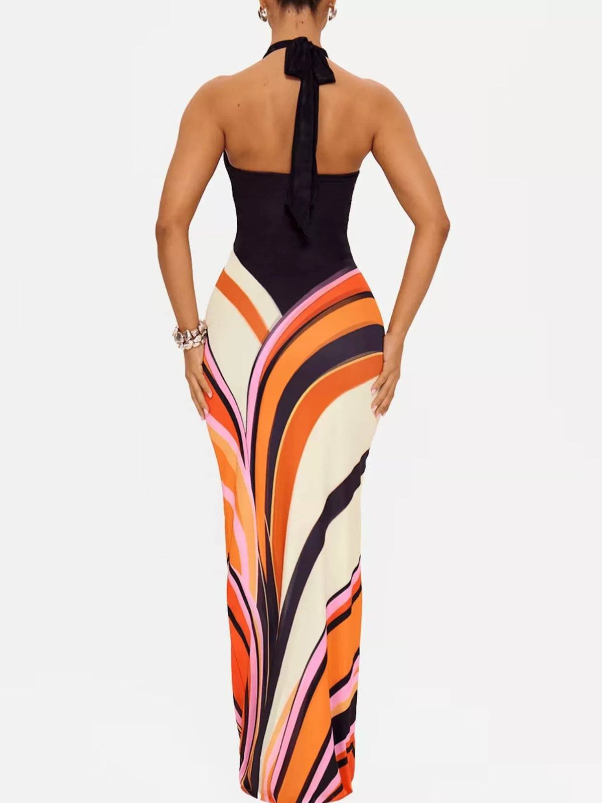 Halter neck maxi dress with abstract print from Plush Fashion Hub, flowing fabric and stylish design for elegant occasions.