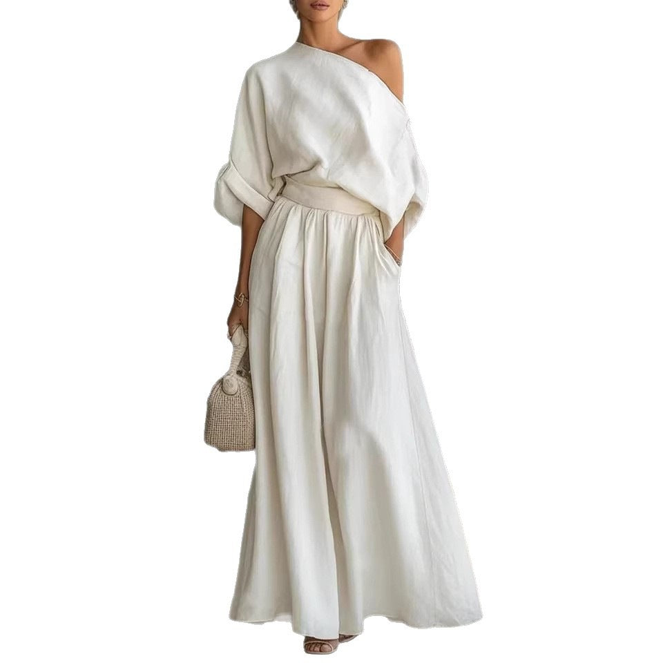 Elegant fitted asymmetrical shoulder top and matching pants two-piece outfit by Plush Fashion Hub, styled for a chic look.