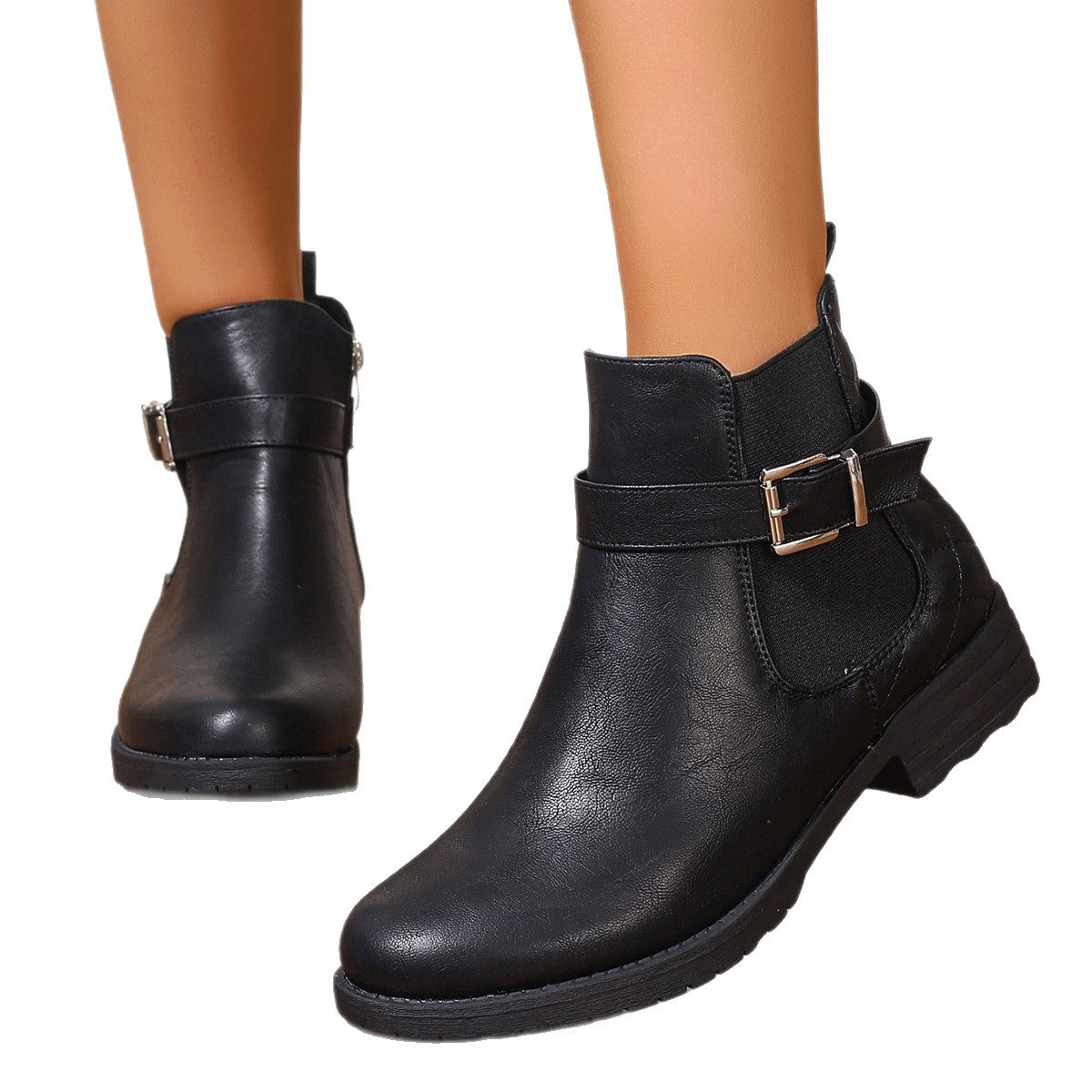 Black faux leather ankle boots with a side buckle, elastic gore, and low block heel.